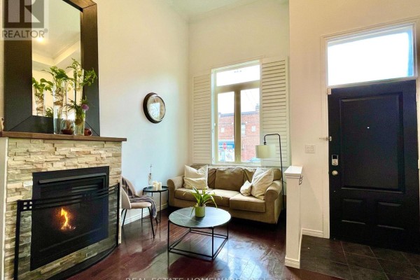 Empty room with gray walls, recessed lighting, and hardwood flooring. - 287 Kingswood Road, Toronto