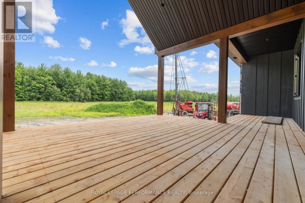 Wooden deck with tractor and drilling rig - 288 Route 300 East Route The Nation