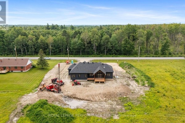 Modern new construction home with dark siding and wood deck - 288 Route 300 East Route The Nation