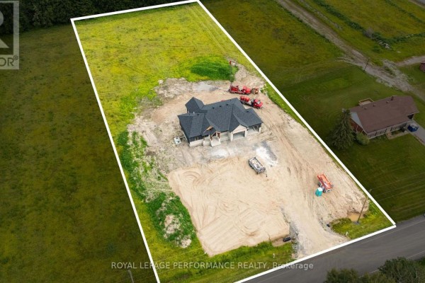 New construction home with trucks on site - 288 Route 300 East Route The Nation