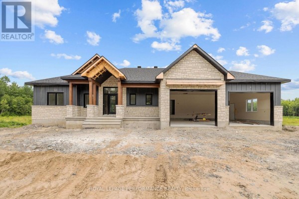 Front view of a large, modern house under construction on a rural property. - 288 Route 300 East Route, The Nation