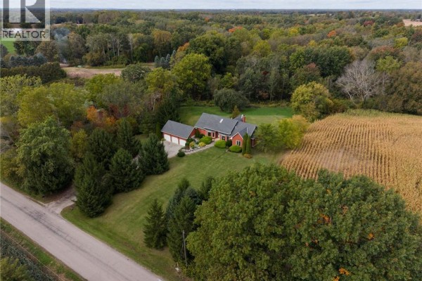 Expansive aerial view of the property at 288 Thirteenth Concession Road, showing the house, garage, and extensive grounds. - 288 Thirteenth Concession Road, Scotland