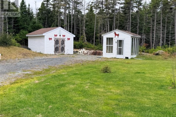 Two white sheds, one with double doors and red bows, the other with a horse decal and screen door. - 29-31 Spracklin's Avenue, Cupids