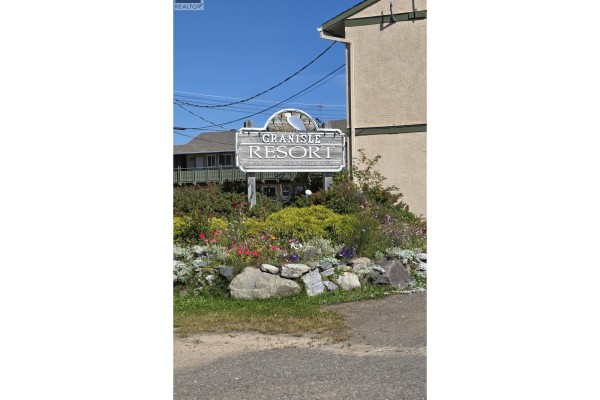Signage for Granisle Resort with colorful flowers and landscaping. - 29 50 Hagan Street, Granisle