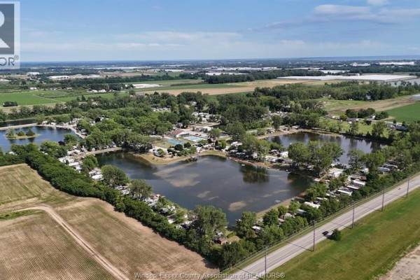 Aerial view of a rural landscape featuring a campground with lakes. - 29 Apple Lane, Leamington