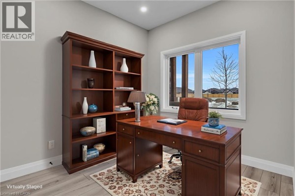 Bedroom with a king-size bed, large window, and closet. - 29 Weymouth Street Unit# 27, Elmira