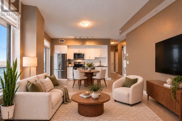 Bedroom with a large window, queen-size bed, wooden nightstands, and a plant. - 2908 - 3600 Highway 7, Vaughan