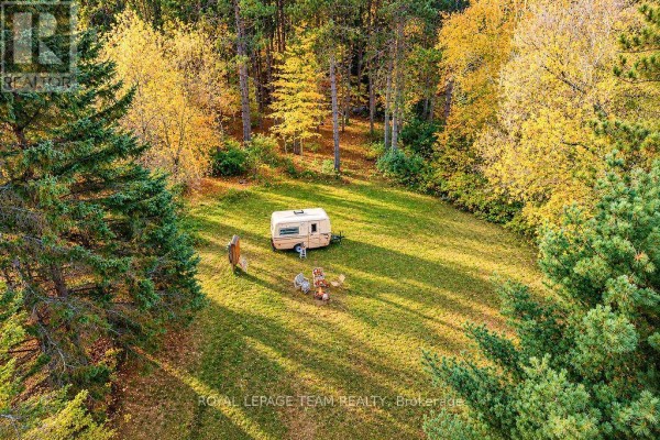 Aerial view of the property and surrounding area, showing nearby homes and roads. - 2909 Round Lake Road, Killaloe, Hagarty And Richards