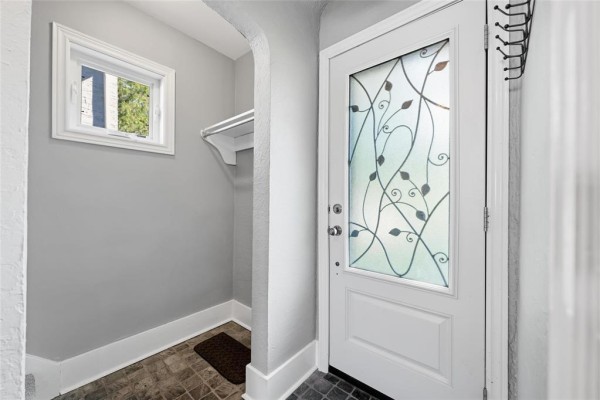 Interior view of the small foyer with a glass-paneled door. - 291 Campbell Street, Winnipeg