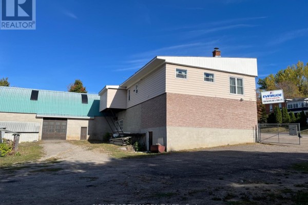 Side view of the commercial building with a green roof and access stairs. - 292 Bonnechere Street W, Bonnechere Valley