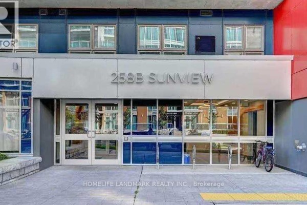 Building entrance to 258B Sunview with glass doors, signage, and bicycle parking. - 293 - 258b Sunview Street, Waterloo