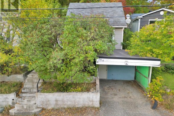 Aerial view of the house entrance with a carport and driveway. - 294 Kathleen Street, Sudbury