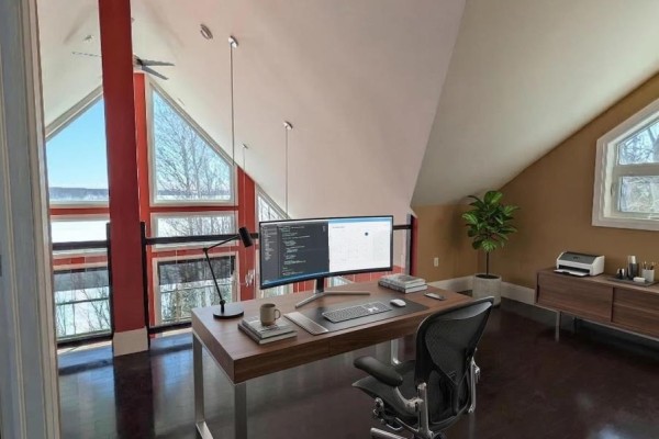 Living room with large windows, stone fireplace, and polished concrete floor. - 294 Terra Tory Dr, Lanark