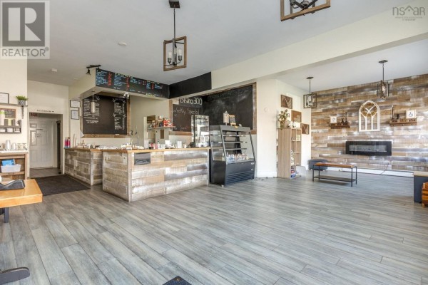 Interior view of a café with a service counter, wooden accents, and modern lighting - 296-300 Main Street, Middleton