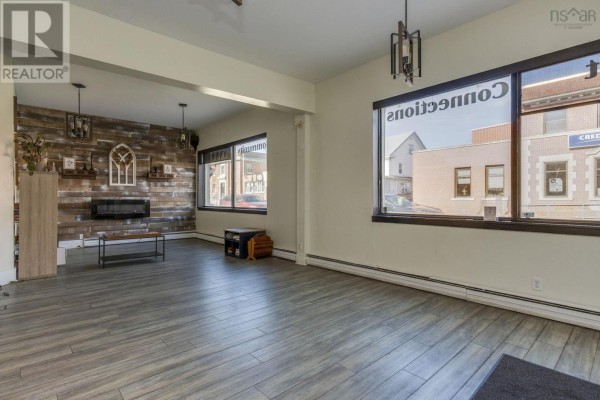 Spacious room with large windows, wooden wall feature, and open layout - 296-300 Main Street, Middleton