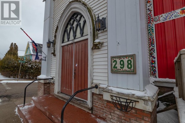 Close-up of the red double doors of the former church building with address number 298. - 298 Granville Street, Bridgetown