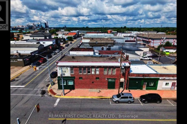 Aerial view showcasing the building's facade and surrounding commercial area. - 298 Scott Street, Fort Frances