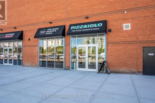 Counter with POS systems and large windows showing building exterior. - 2a - 1 Promenade Circle, Vaughan