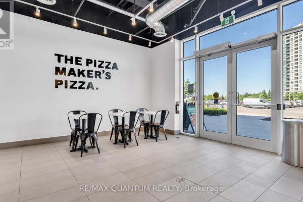 Service counter with refrigerated display, wood paneling, and seating area. - 2a - 1 Promenade Circle, Vaughan