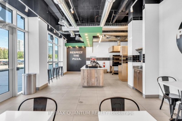Service counter with POS systems, large windows, and seating area. - 2a - 1 Promenade Circle, Vaughan