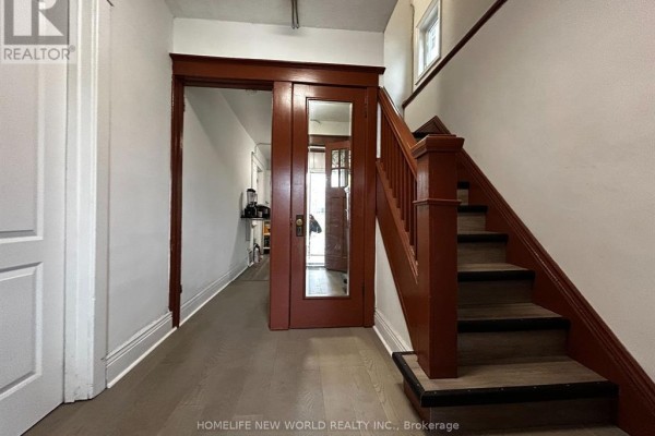 Interior hallway with a staircase, sliding door with mirror, and light gray flooring. - 2nd Rm 3 - 46 Arnold Street, Hamilton