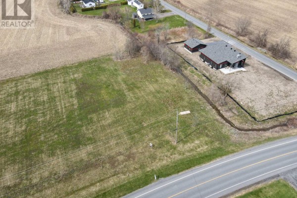 Aerial perspective of Lot #3 showing its proximity to nearby houses and road. - 3 - 0000 Lakeshore Drive, South Dundas