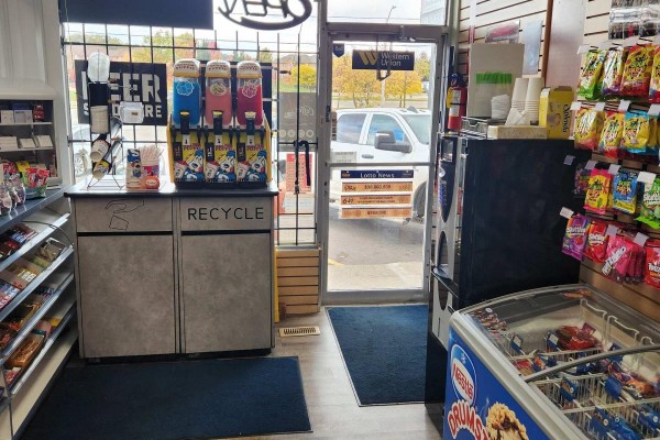 Interior view of convenience store featuring snack aisles, beverage dispensers, and freezer section. - 3 - 136 Guelph Street, Halton Hills