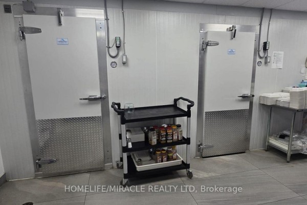 Walk-in refrigerators with diamond plate bases and a rolling cart with spices. - #3 - 17477 Ontario County Hwy 2, Quinte West