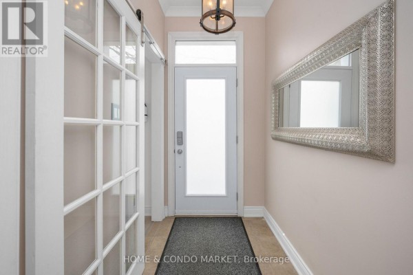 Small bathroom with a sink, toilet, and shower with a floral curtain. - 3 - 194 Lakeshore Road W, Mississauga