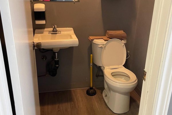 Small bathroom with a white sink, white toilet, and grey walls. - 3 - 511 Welham Road, Barrie