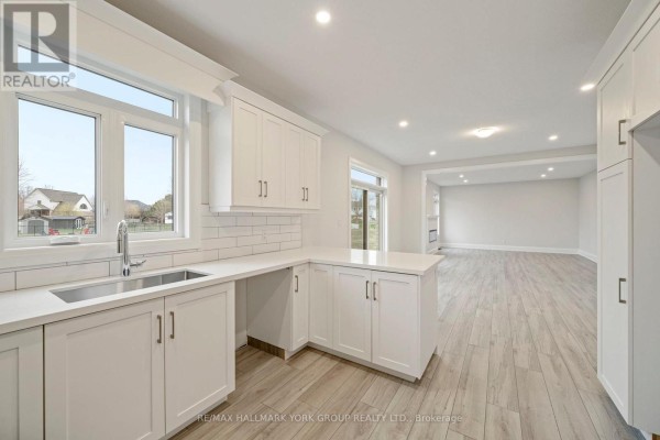 Modern kitchen with white cabinets, island & subway tile - 3 Bouw Street Dutton/dunwich