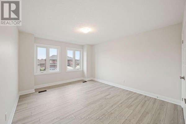Empty bedroom with light wood floors & two windows - 3 Bouw Street Dutton/dunwich