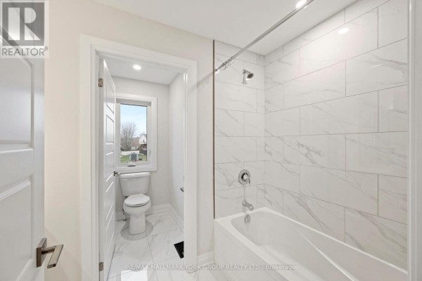 Modern bathroom with tub, shower, and marble tile - 3 Bouw Street Dutton/dunwich