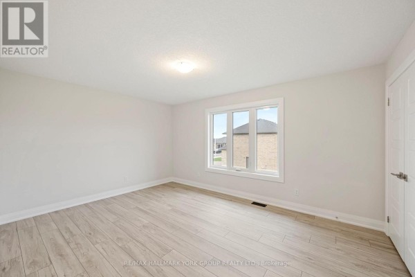 Bedroom with light wood floors and large window - 3 Bouw Street Dutton/dunwich