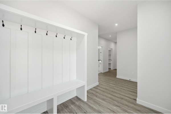 Bright bedroom with large window, white walls, and light-colored flooring. - 3 Pierwyck Lo, Spruce Grove