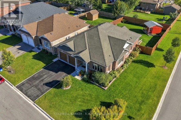 Aerial view of a brick bungalow with a double garage and large green backyard. - 3 Pollock Avenue, Brock