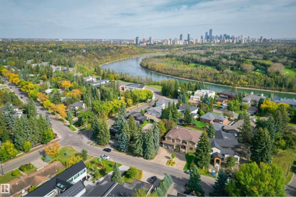 Aerial view of a suburban neighborhood with mature trees and a river. - 3 Riverside Cr Nw, Edmonton