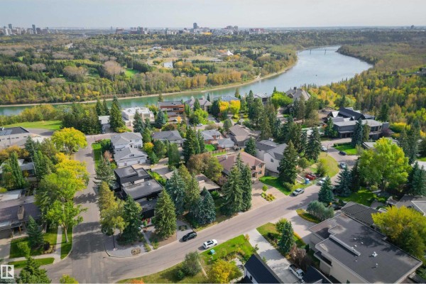 Aerial view of upscale homes surrounded by trees with a river nearby. - 3 Riverside Cr Nw, Edmonton