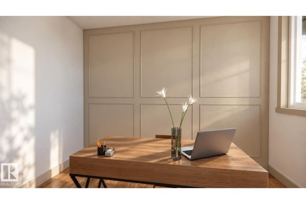 A home office with a wooden desk, a laptop, and textured beige wall panels. - 30 Brickyard Vw, Stony Plain