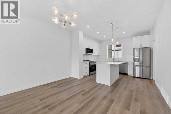 Kitchen - 30 Creekside Avenue Sw, Calgary, AB T2X6E2 Photo 3