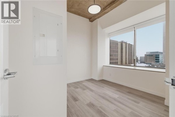 Bright corner living space with panoramic windows and city views. - 30 Duke Street W Unit# 315, Kitchener