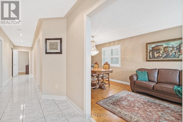 Aerial view of a large backyard with lawn, garden beds, and mature trees. - 30 Graceview Court, Vaughan