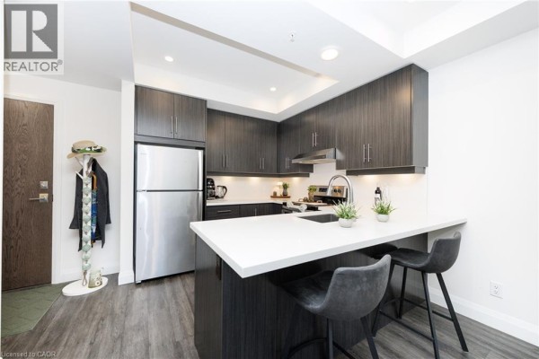 Exterior view of the apartment building with multiple balconies and contemporary design - 30 Hamilton Street S Unit# 201, Waterdown