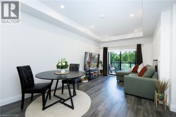 Hallway leading to unit 201, featuring neutral walls and lighting fixtures - 30 Hamilton Street S Unit# 201, Waterdown