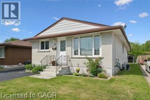 Front exterior view of a single-story house with light brick siding. - 30 Kimberly Road Unit# Upper Unit, Cambridge