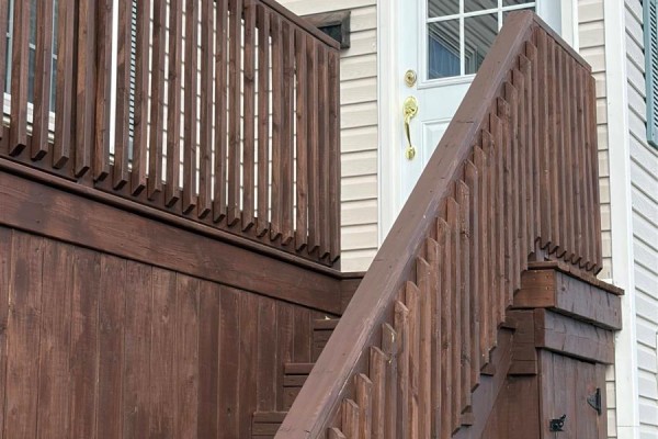 Wooden stairs and deck leading to the front entrance with house number 30. - 30 Monroe Street, St John S