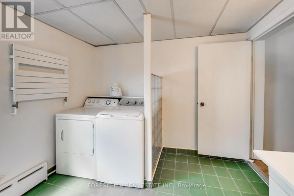 Washing machine, dryer, drying rack, and glass block partition - 30 Robert Street Toronto