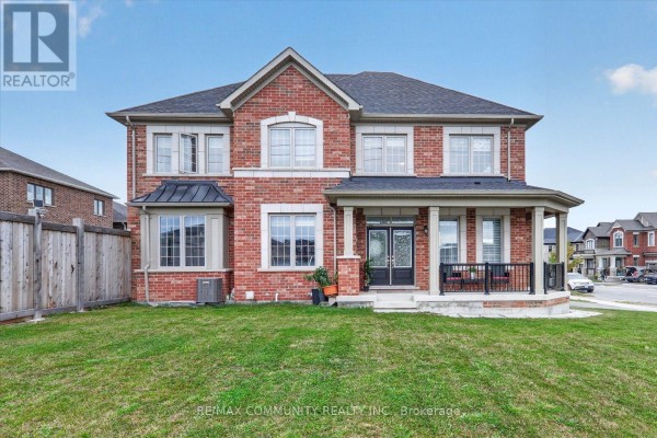 Exterior of a brick two-story house with a covered front porch. - 3001 Hollyberry Trail, Pickering