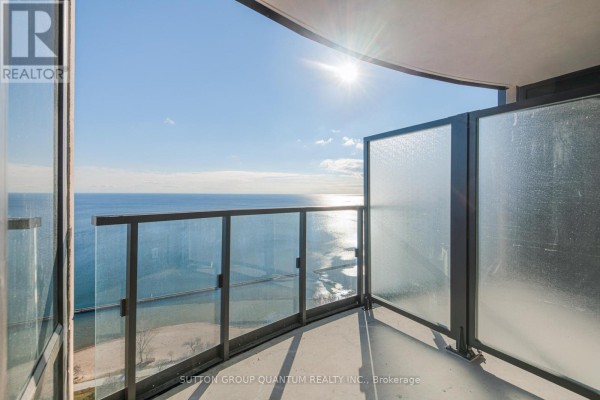 Balcony with glass railing overlooking Lake Ontario and shoreline. - 3008 - 1926 Lake Shore Boulevard W, Toronto