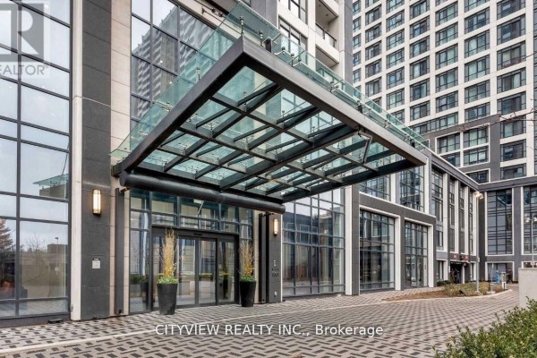 Glass canopy over the entrance to a modern building. - 3009 - 7 Mabelle Avenue, Mississauga